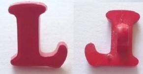 bottone lettera L rosso bottone lettera L rosso